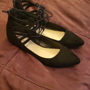 Black laced up flats